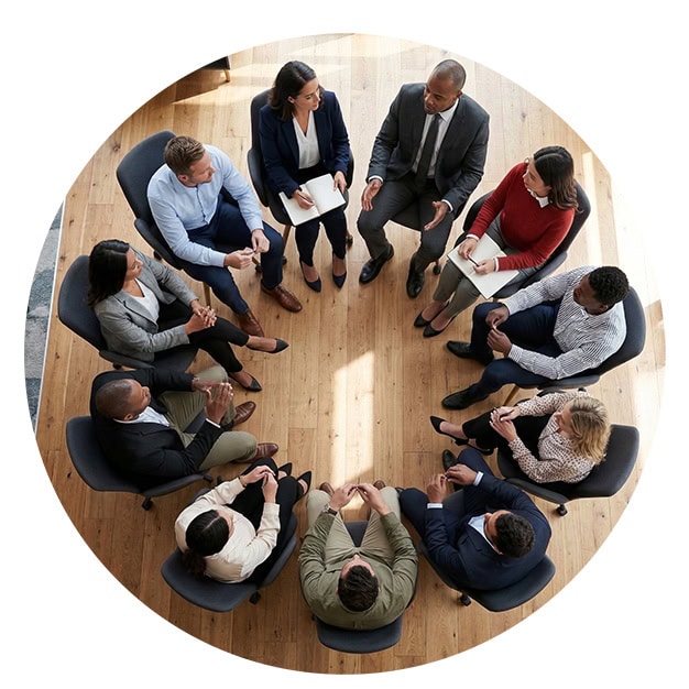 A group of business people learning from one another through structured peer coaching